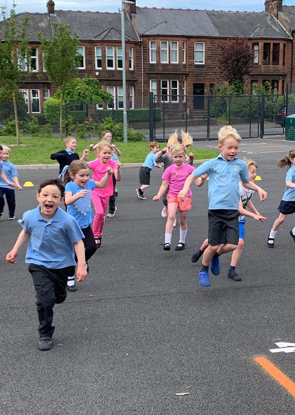 children running and jumping in the air